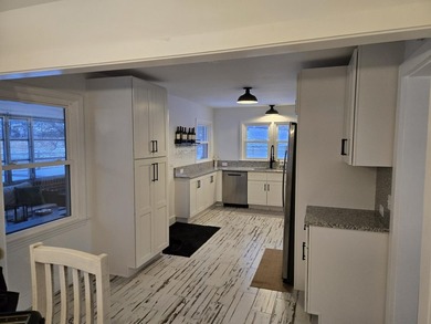 Kitchen has been remodeled, with new, cabinets, flooring and - photo 11