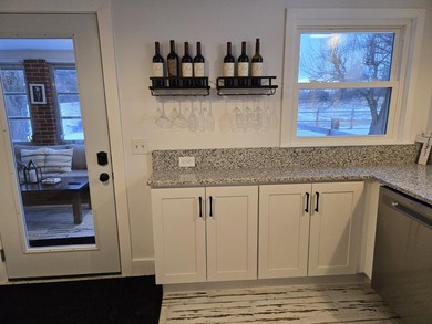 Kitchen has been remodeled, with new, cabinets, flooring and - photo 17
