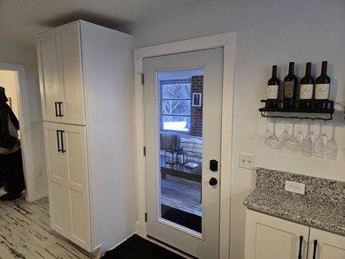 Kitchen has been remodeled, with new, cabinets, flooring and - photo 18