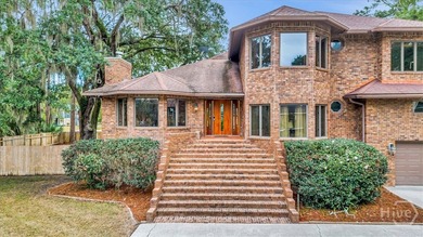 This inviting 5-bedroom, 3-bath all-brick home sits on just - photo 2