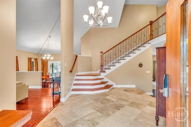 This inviting 5-bedroom, 3-bath all-brick home sits on just - photo 3