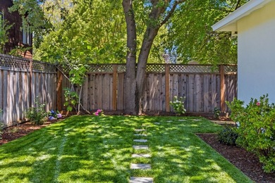 Situated on a picturesque tree-lined street and located down a - photo 39