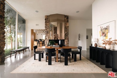 Tucked in an exclusive pocket of the Hollywood Hills, this - photo 11