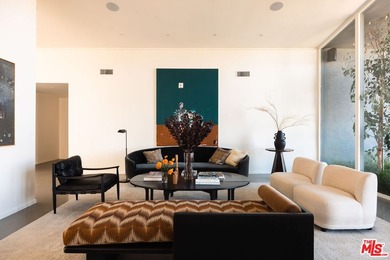 Tucked in an exclusive pocket of the Hollywood Hills, this - photo 14