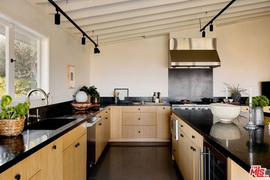 Tucked in an exclusive pocket of the Hollywood Hills, this - photo 21
