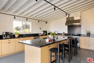 Tucked in an exclusive pocket of the Hollywood Hills, this - photo 22