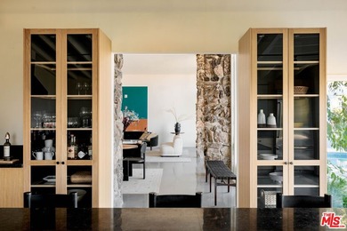 Tucked in an exclusive pocket of the Hollywood Hills, this - photo 23