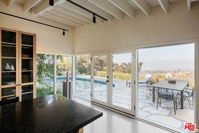 Tucked in an exclusive pocket of the Hollywood Hills, this - photo 24
