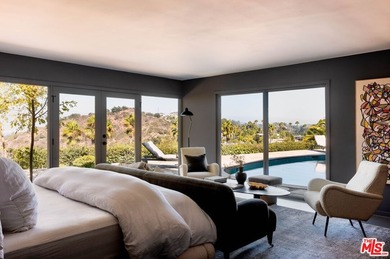 Tucked in an exclusive pocket of the Hollywood Hills, this - photo 30