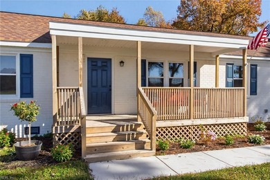 Welcome to this fully remodeled all-brick ranch located in the - photo 3
