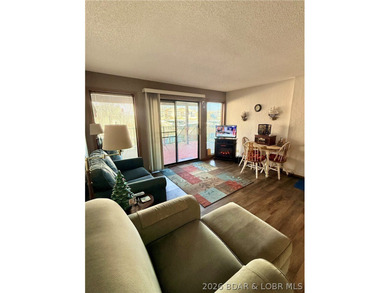 Step into easy lake living with a completely turn-key 2 bed, 2