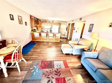 Step into easy lake living with a completely turn-key 2 bed, 2