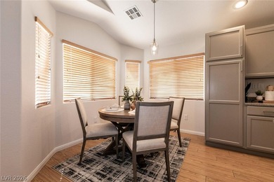 Beautiful single-story end-unit townhome located in a gated