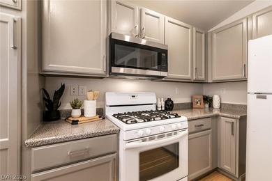 Beautiful single-story end-unit townhome located in a gated