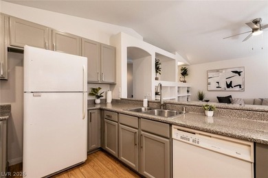 Beautiful single-story end-unit townhome located in a gated