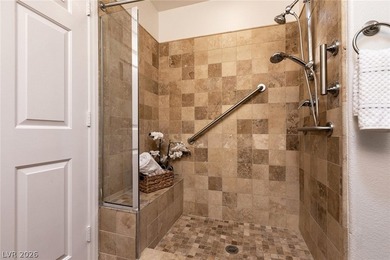 Beautiful single-story end-unit townhome located in a gated