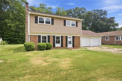 Welcome home to this charming 4-bedroom residence in the highly - photo 1