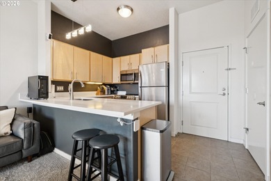 Top-floor, end-unit condo offering added privacy, natural light