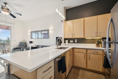 Top-floor, end-unit condo offering added privacy, natural light