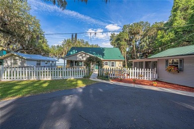 Tucked away on beautiful Lake Weir, this charming gated - photo 49