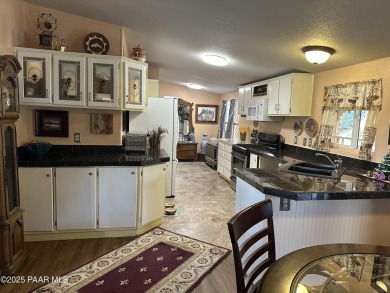 Charming 3-bedroom home on a spacious lot in Mayer! Enjoy the