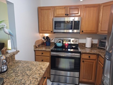 Enjoy peaceful lake views from this charming second-floor pet - photo 12