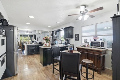 Enjoy stunning golf course and lake views from this exceptional - photo 13