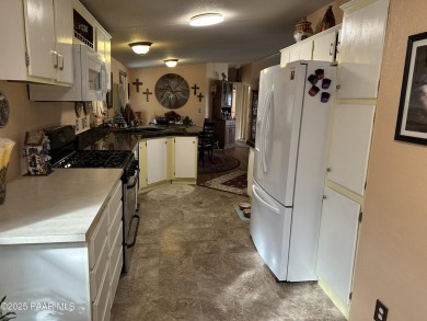 Charming 3-bedroom home on a spacious lot in Mayer! Enjoy the