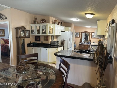 Charming 3-bedroom home on a spacious lot in Mayer! Enjoy the