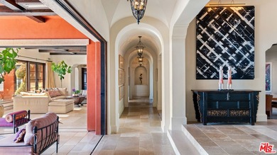 Enter through a grand metal, glass, and wood front door framed - photo 10