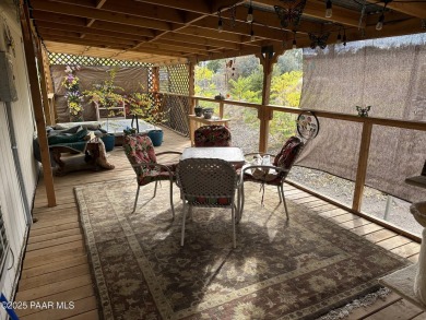 Charming 3-bedroom home on a spacious lot in Mayer! Enjoy the