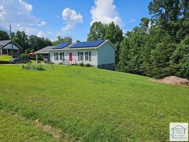 This cozy 2 bedroom 2 bath home offers energy independence, with