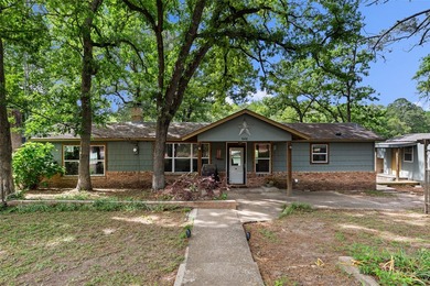 Tucked away in the towering pineywoods of East Texas, this - photo 1