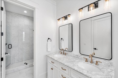 This incredible NEW CONSTRUCTION coastal home is located south - photo 24