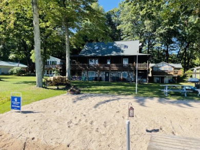 Welcome to your Pretty Lake Log home located on pristine - Lake Home For Sale in Mecosta, Michigan