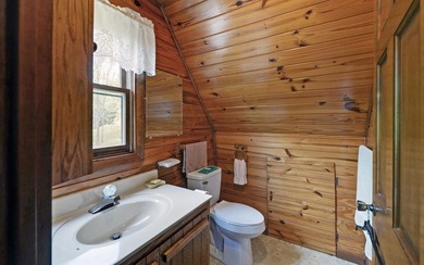 Wake up where the river is the main event. This true log cabin - photo 12