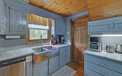 Wake up where the river is the main event. This true log cabin - photo 22