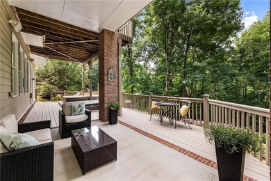 Tucked among mature hardwoods on a private 1.25+/- acre river - photo 2