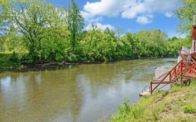 Wake up where the river is the main event. This true log cabin - photo 36