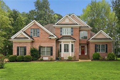 Nestled on a level one-acre lot in the prestigious Island at - photo 1
