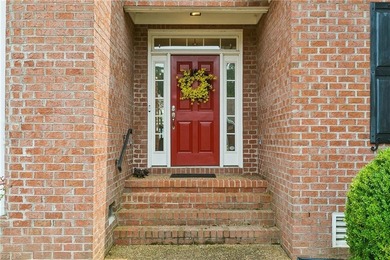 Nestled on a level one-acre lot in the prestigious Island at - photo 2