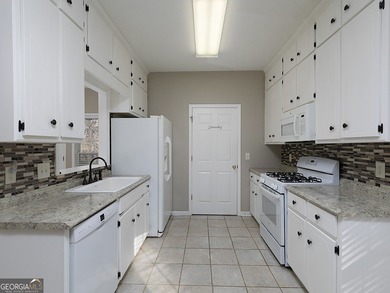 Charming two bedroom, two bath, RANCH on almost 1 acre in Canton