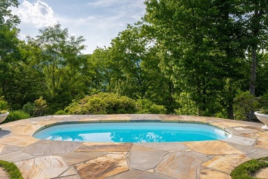 Perched above the pristine waters of Lake Fontana, this - photo 3