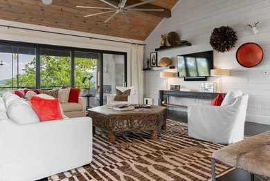 Perched above the pristine waters of Lake Fontana, this - photo 6
