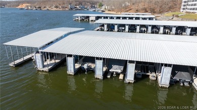 Huge screened deck, 12x32 boat slip with 8,000 lb lift, and rare - photo 34