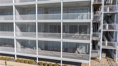 Huge screened deck, 12x32 boat slip with 8,000 lb lift, and rare - photo 38
