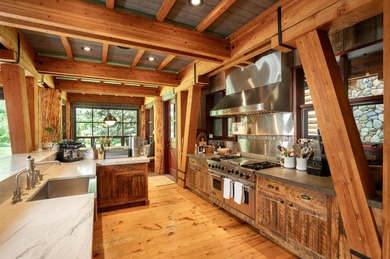Set on 2.5 acres directly on the Bigwood River within a private - photo 14