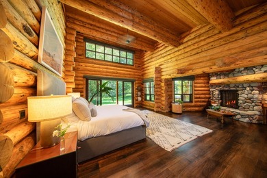 Set on 2.5 acres directly on the Bigwood River within a private - photo 18