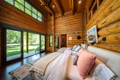 Set on 2.5 acres directly on the Bigwood River within a private - photo 21