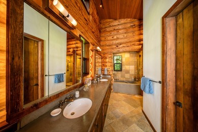 Set on 2.5 acres directly on the Bigwood River within a private - photo 23